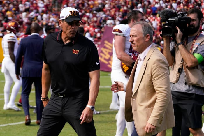 Washington Commanders head coach walks with Washington Commanders managing partner Josh Harris following the Commanders victory over the Arizona Cardinals at FedExField.